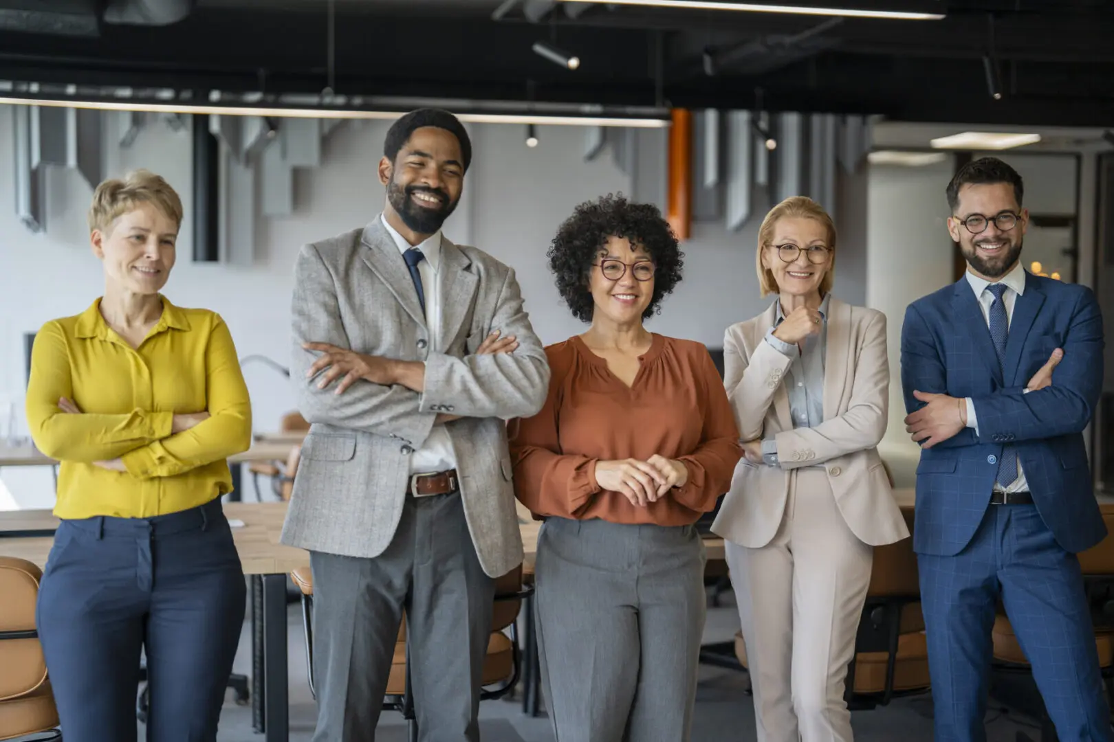 Business team posing together indoors